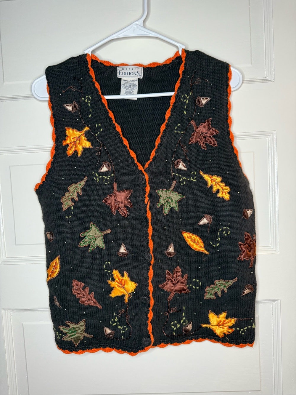 Basic Editions Black Leaf-Appliqué V-Neck Sweater Vest with Orange Trim